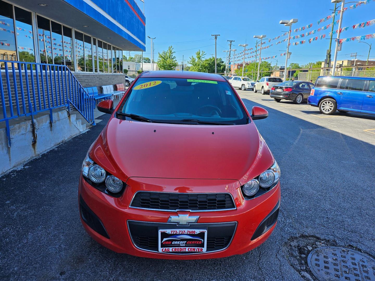 2012 ORANGE Chevrolet Sonic 1LT Sedan (1G1JD5SB8C4) with an 1.4L L4 DOHC 24V TURBO FFV engine, located at 7600 S Western Ave., Chicago, IL, 60620, (773) 918-3980, 0.000000, 0.000000 - Photo#2